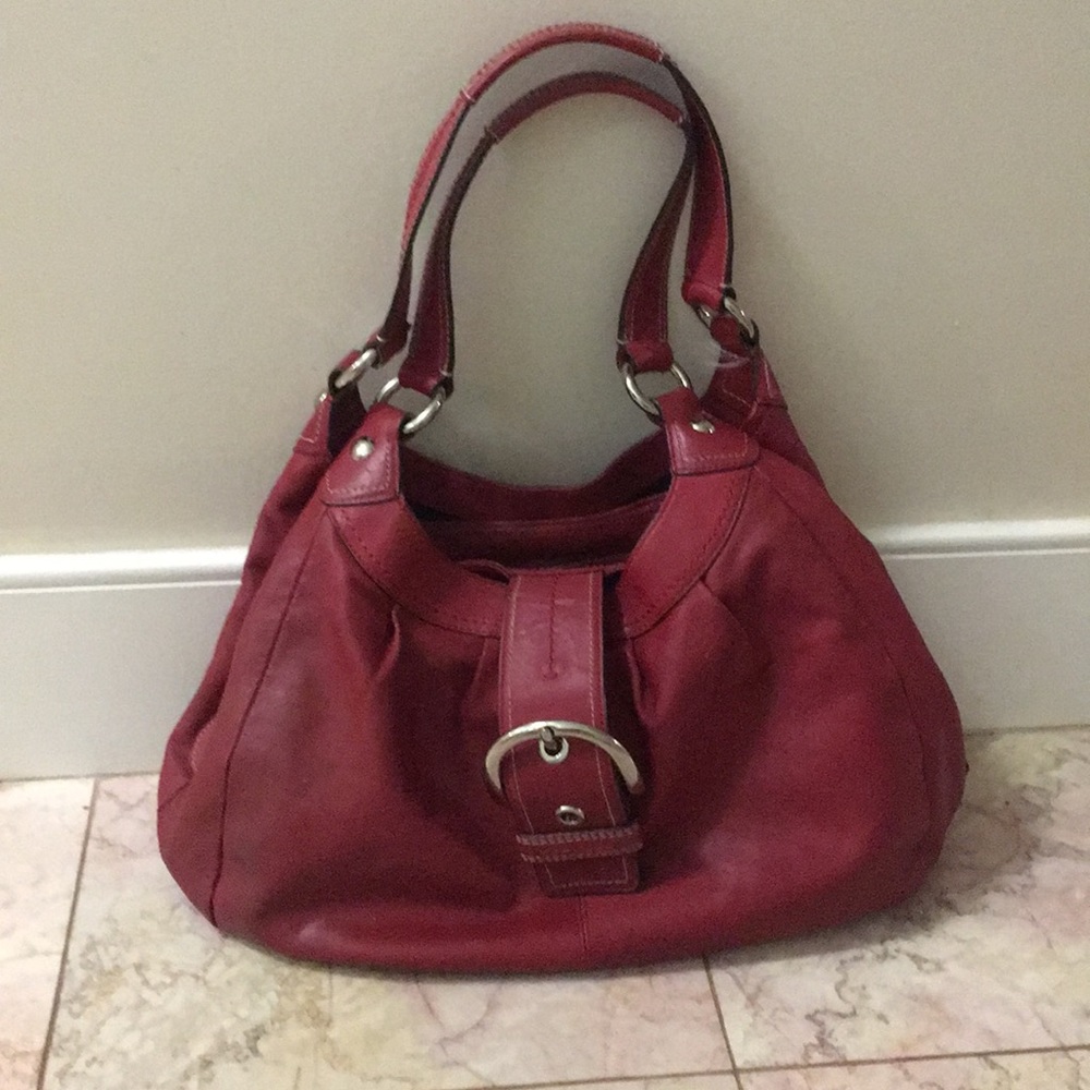 Red leather coach purse has 2 stains on back